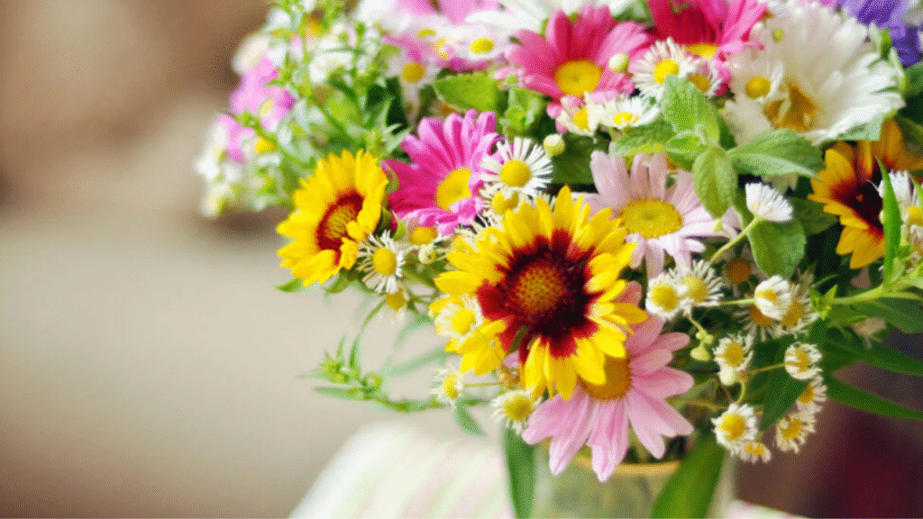 Using filler flowers like snapdragons and Bells of Ireland to fill gaps in bouquet"

