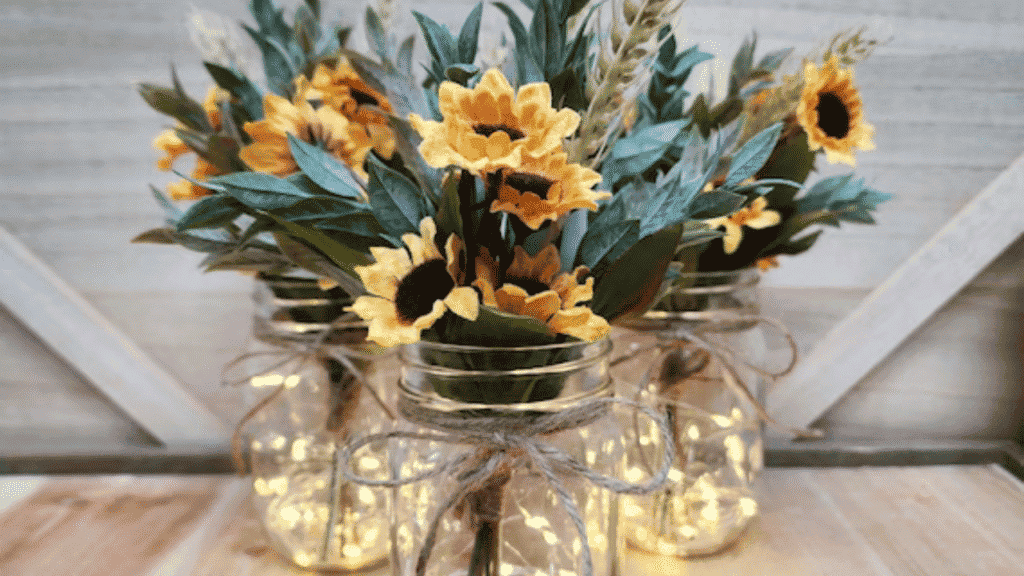 Farm-fresh flower bouquets in mason jars at a market table"