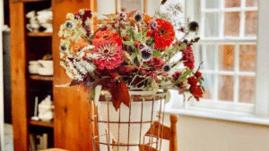 Rustic Flower Arrangement with Dried and Fresh Blooms in Vintage Container