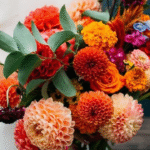 Freshly cut mixed bouquet featuring ranunculus, dahlias, and zinnias representing flower farming trends 2025"