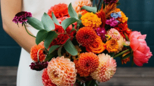 Freshly cut mixed bouquet featuring ranunculus, dahlias, and zinnias representing flower farming trends 2025"