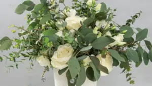 Gathering fresh greenery to create the base structure of a bouquet"